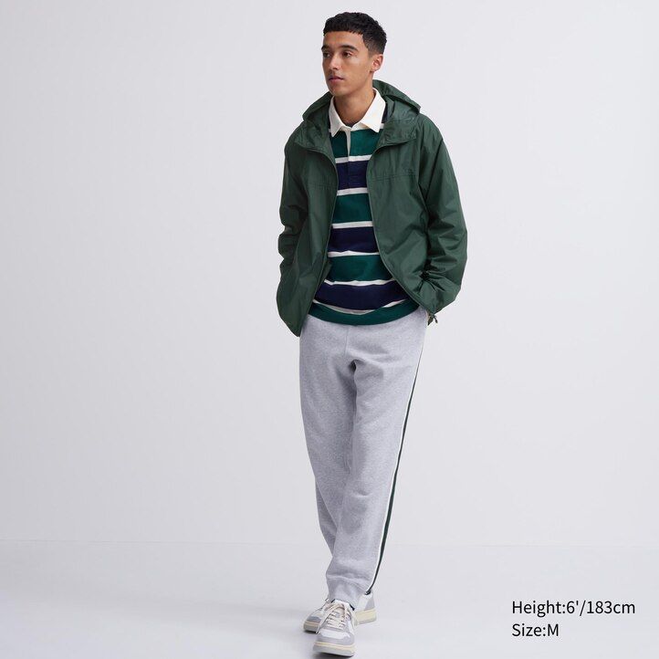 orangefarbene uniqlo herrenjacke mit uv-schutz 3d-schnitt und taschen