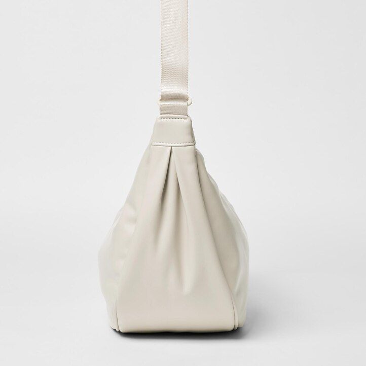 gelbe runde uniqlo-schultertasche für damen